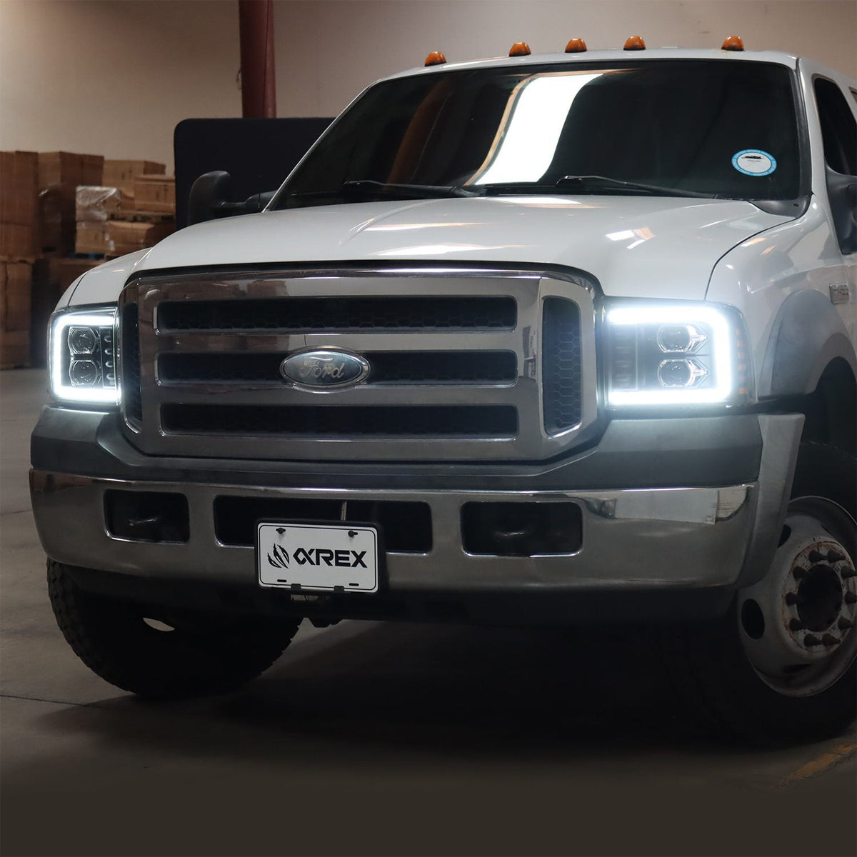 AlphaRex 05-07 Ford Super Duty/Excursion PRO-Series Halogen Projector Headlights Black