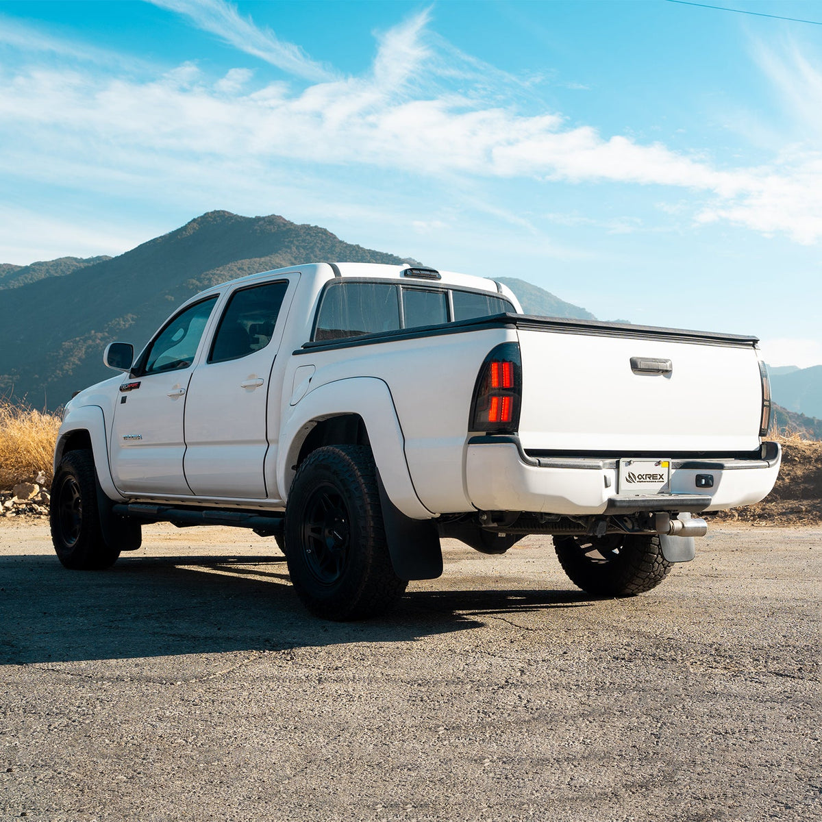 AlphaRex 05-15 Toyota Tacoma NOVA-Series Prismatic LED Tail Lights Black Clear