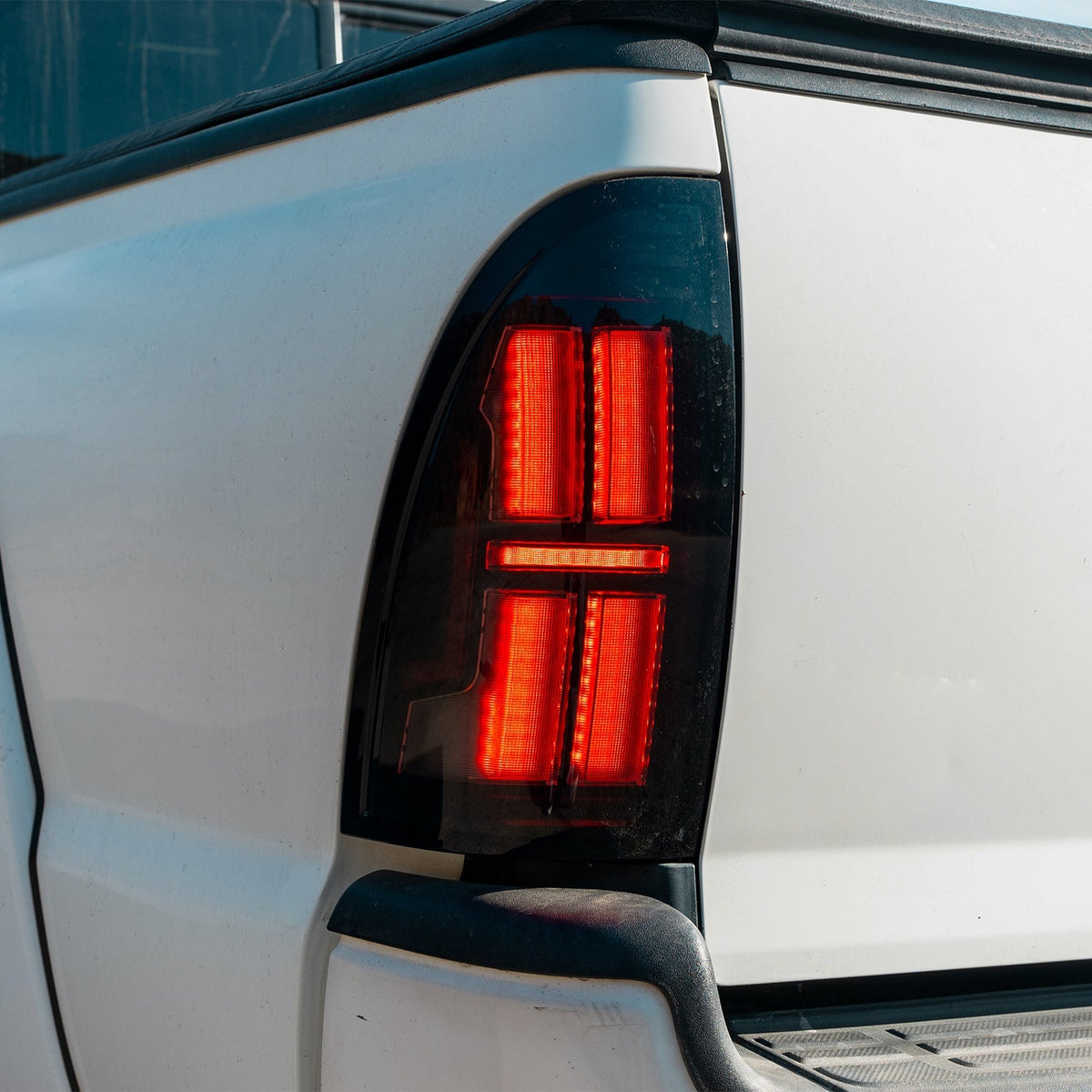 AlphaRex 05-15 Toyota Tacoma NOVA-Series Prismatic LED Tail Lights Black Clear