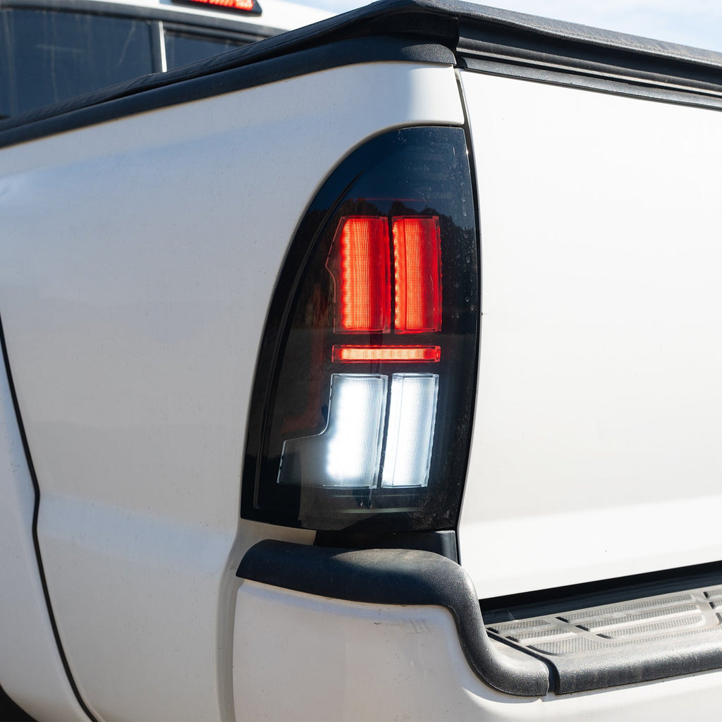 AlphaRex 05-15 Toyota Tacoma NOVA-Series Prismatic LED Tail Lights Black Clear