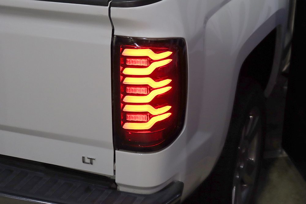 AlphaRex 14-18 Chevrolet Silverado 1500 / 15-19 Silverado 2500HD/3500HD / 15-19 GMC Sierra 3500HD Dually LUXX-Series LED Tail Lights Black Smoke