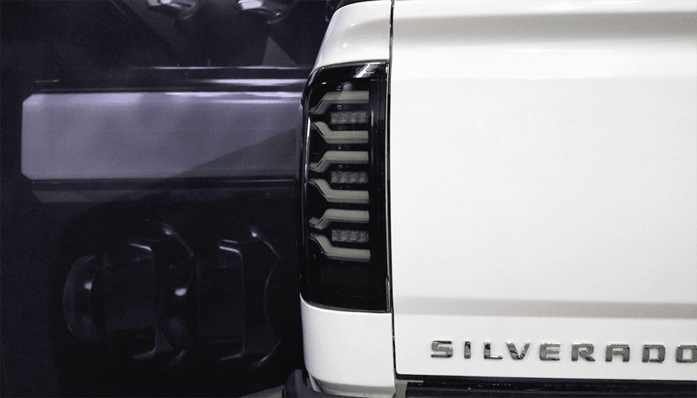 AlphaRex 14-18 Chevrolet Silverado 1500 / 15-19 Silverado 2500HD/3500HD / 15-19 GMC Sierra 3500HD Dually LUXX-Series LED Tail Lights Black Smoke