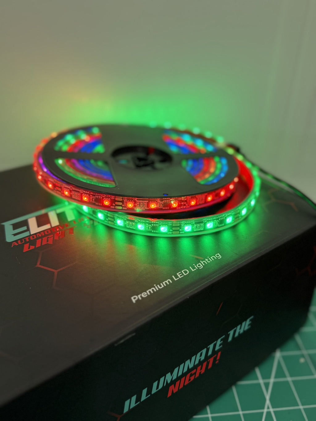 5M RGB chase LED strip roll on reel with Elite LEDs packaging showing chase effect