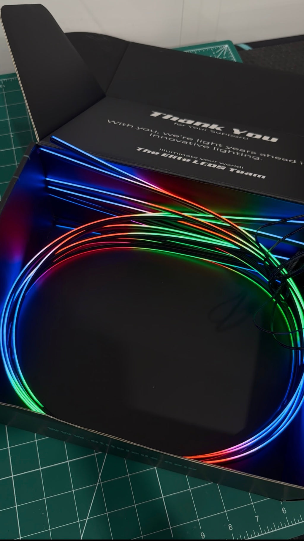 AMB-ELITE-8 kit showing RGB fiber optic strands in full color chase mode