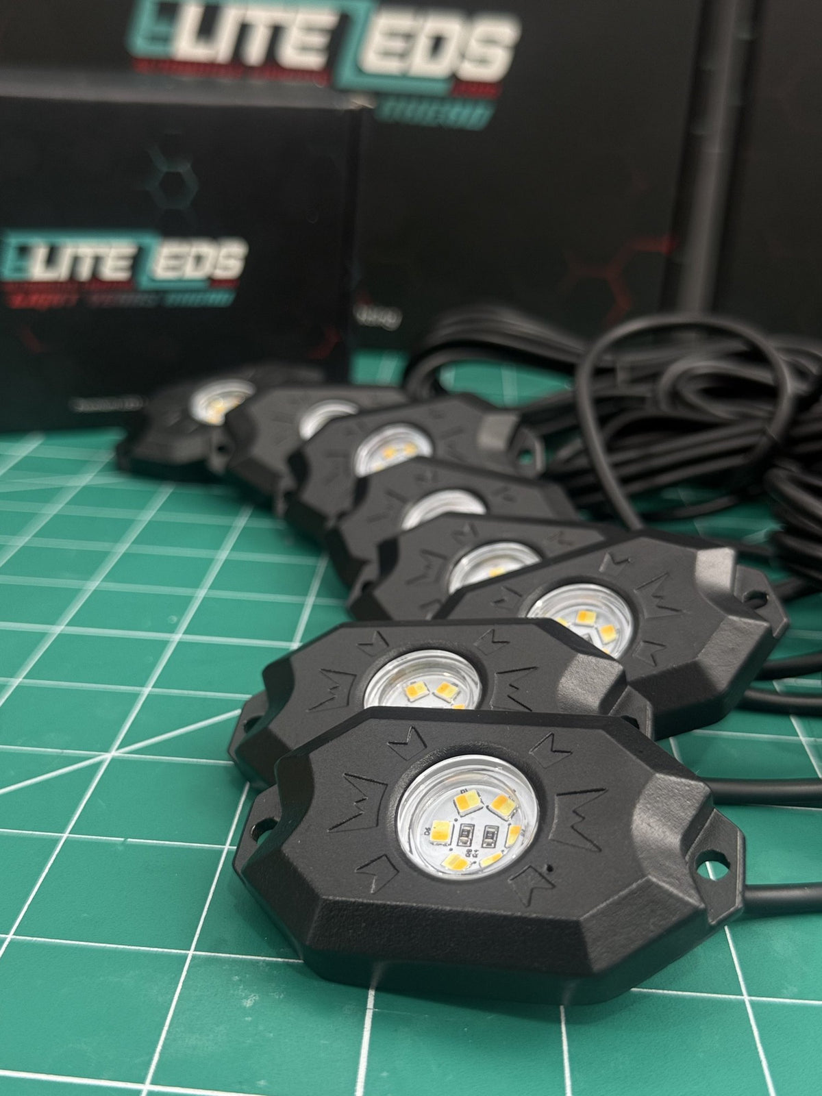 White rock light pods with Elite LEDs packaging showing die-cast aluminum housing
