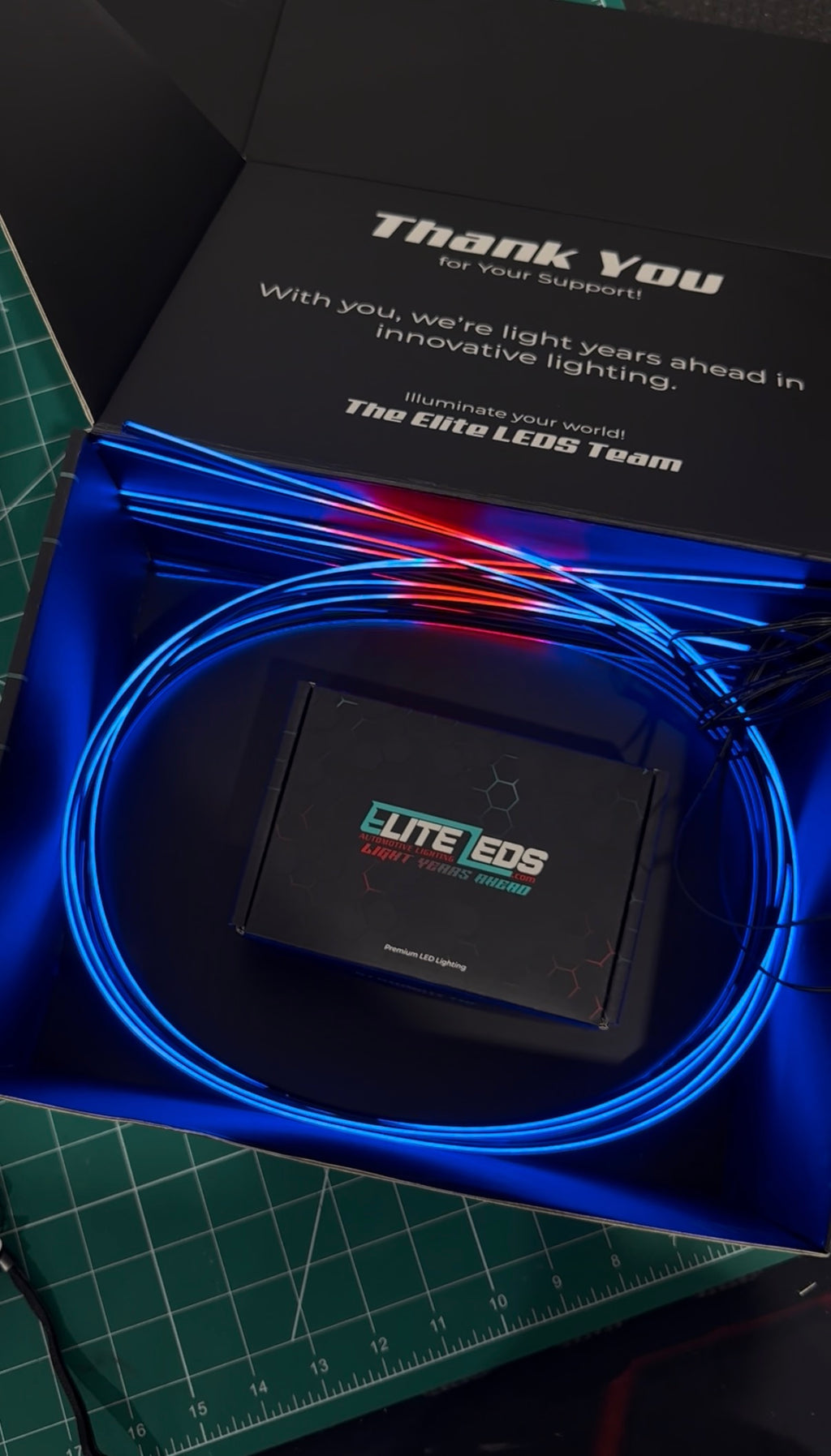 AMB-ELITE-8 kit unboxing showing Elite LEDs premium packaging with blue fiber optic strands